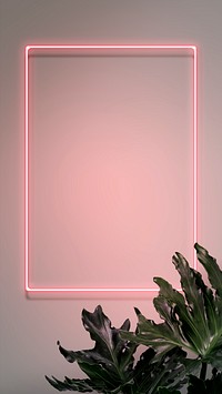 Neon red hello with a flamingo in a frame