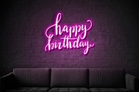 Neon purple happy birthday sign on a wall