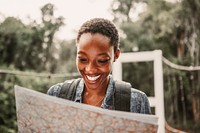 Black woman looking at a map