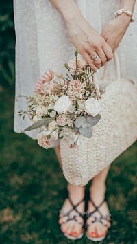 Woman with a woven bag full of flowers