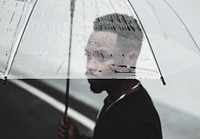 African man using transparent umbrella