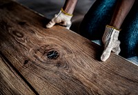 Carpenter installing a wooden floor