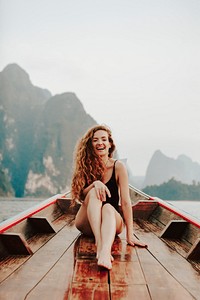 Happy woman enjoy boat ride