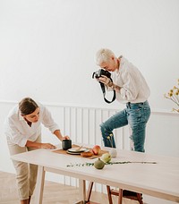 Blogger photographing the plate decor on the dining table