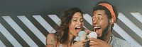 Cheerful couple enjoying an ice cream