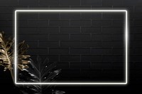 Rectangle white neon frame on tropical leaves background vector