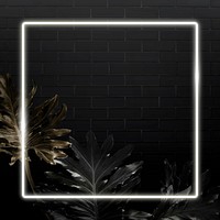 Square white neon frame on tropical leaves background vector