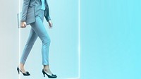 Businesswoman walking on aqua background