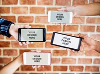 People showing phones mockup in front of a brick wall