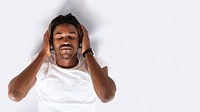 Black man listening to music on his headphones