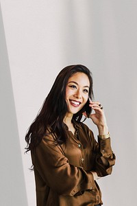 Young happy woman on the phone