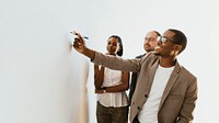 Business people writing on a whiteboard