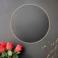 Golden floral frame on a black background