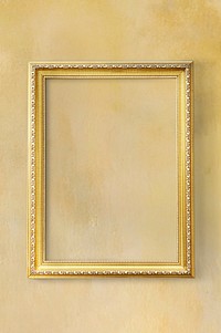 Yellow classic photo frame on a yellow wall