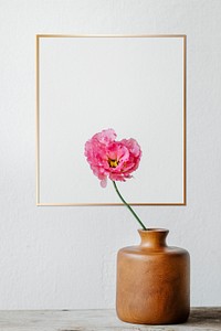 Golden frame on a white wall