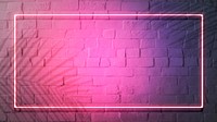 Pink neon lights frame on a white brick wall mockup