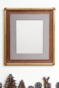 Classic gold frame mockup with Christmas decorations