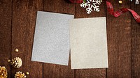 Gold and silver papers mockup with Christmas decorations on wooden background