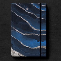 Dark blue book cover on a black table