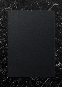 Black paper on a marble background