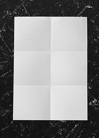 Creased white paper on a marble background