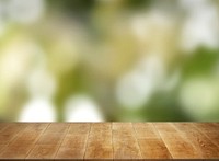Beige wooden planks with blurred natural background