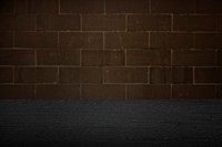 Black wooden plank with brick wall background