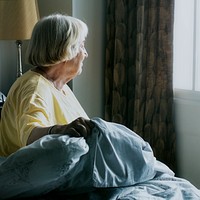 Elderly woman alone at home during social isolation due to Covid-19 pandemic