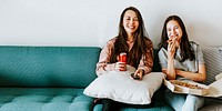 Sisters eating pizza together during coronavirus quarantine