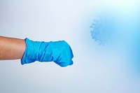 Gloved hand fighting the coronavirus