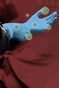 Doctors gloved hand contaminated with coronavirus background