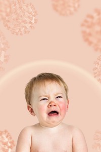 Crying baby on a pink coronavirus contaminated background