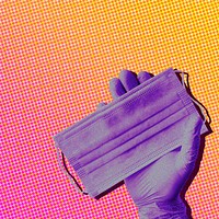 Gloved hand holding a face mask during COVID-19 background