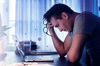 Man feeling sick while working from home during the coronavirus pandemic