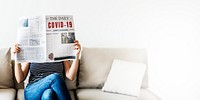 Woman reading coronavirus news from a newspaper during quarantine