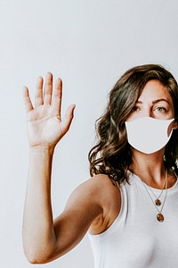 Woman wearing a face mask to prevent coronavirus infection