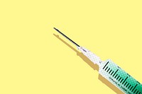 Syringe with a green solution on a yellow background