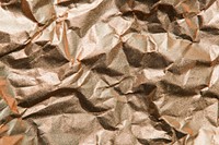 Copper scrunched paper textured background