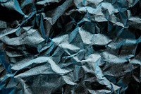 Blue scrunched paper textured background