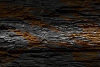 Black wooden plank with brown textured background