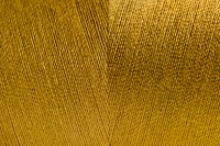 Golden rolled yarn texture background
