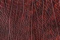 Maroon creased leather textured background