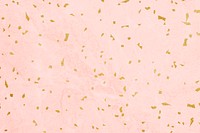 Golden confetti on a marble textured background