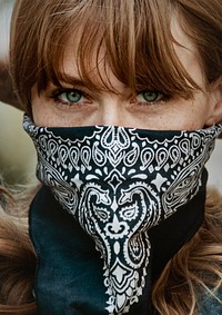 Woman covering her mouth with a bandana during coronavirus outbreak