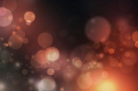 Orange bokeh pattern on a dark background illustration