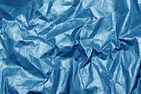 Crumpled blue paper textured background