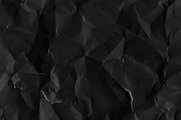 Crumpled black paper textured background