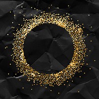 Glittery round frame on a crumpled black paper textured background