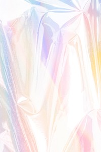 Colorful holographic crumpled aluminum foil textured background