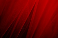 Red tulle drapery textured background